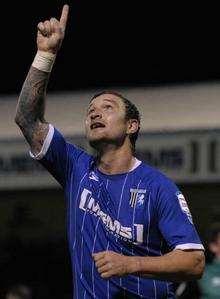Danny Kedwell celebrates after scoring the second penalty