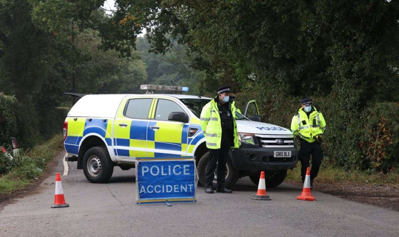 Police at the scene in Lenham Road, Headcorn Picture: UKNIP