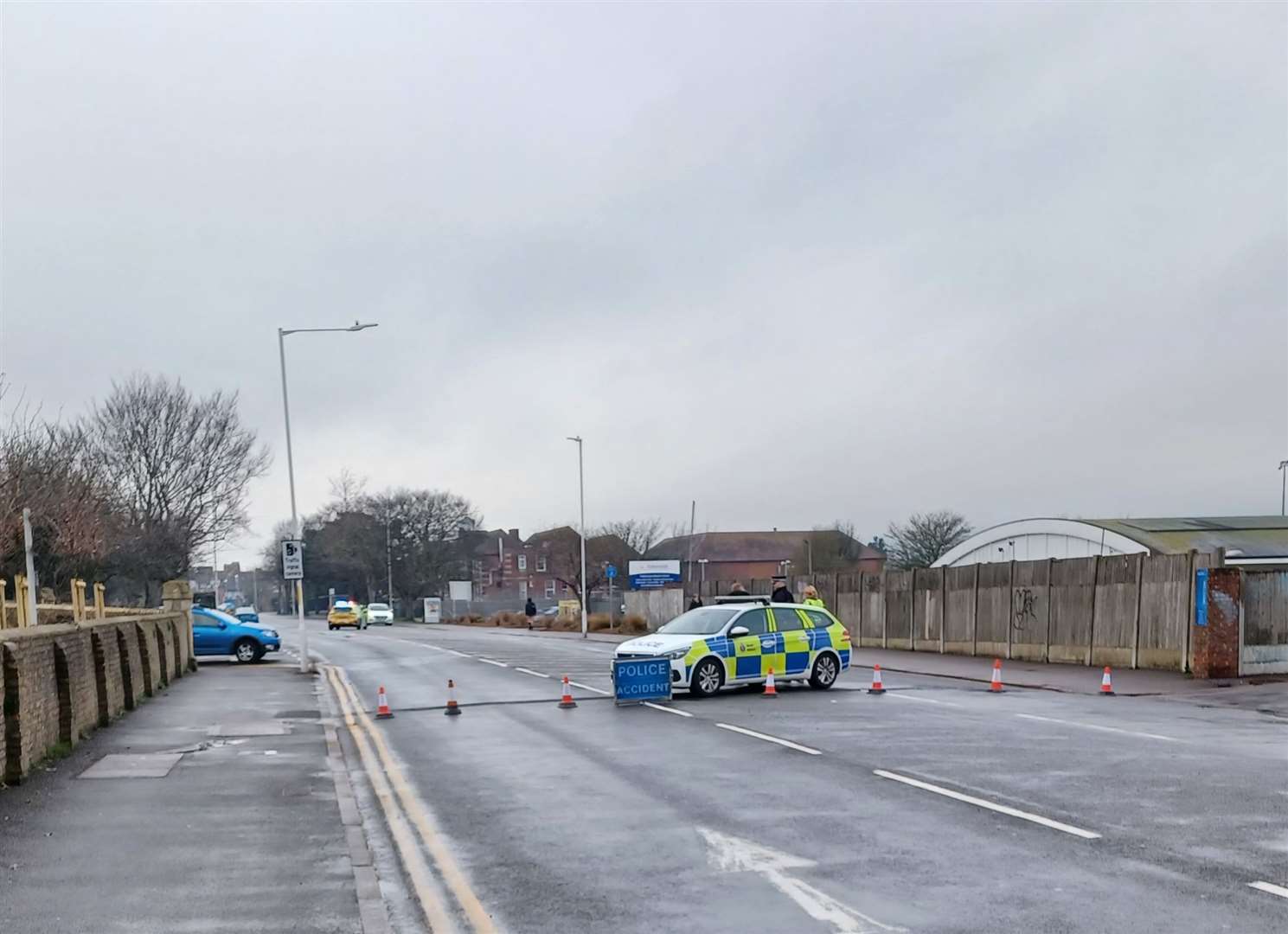 Four police cars are at the scene of a suspected serious incident between the Harvey Grammar School and Morrisons in Folkestone