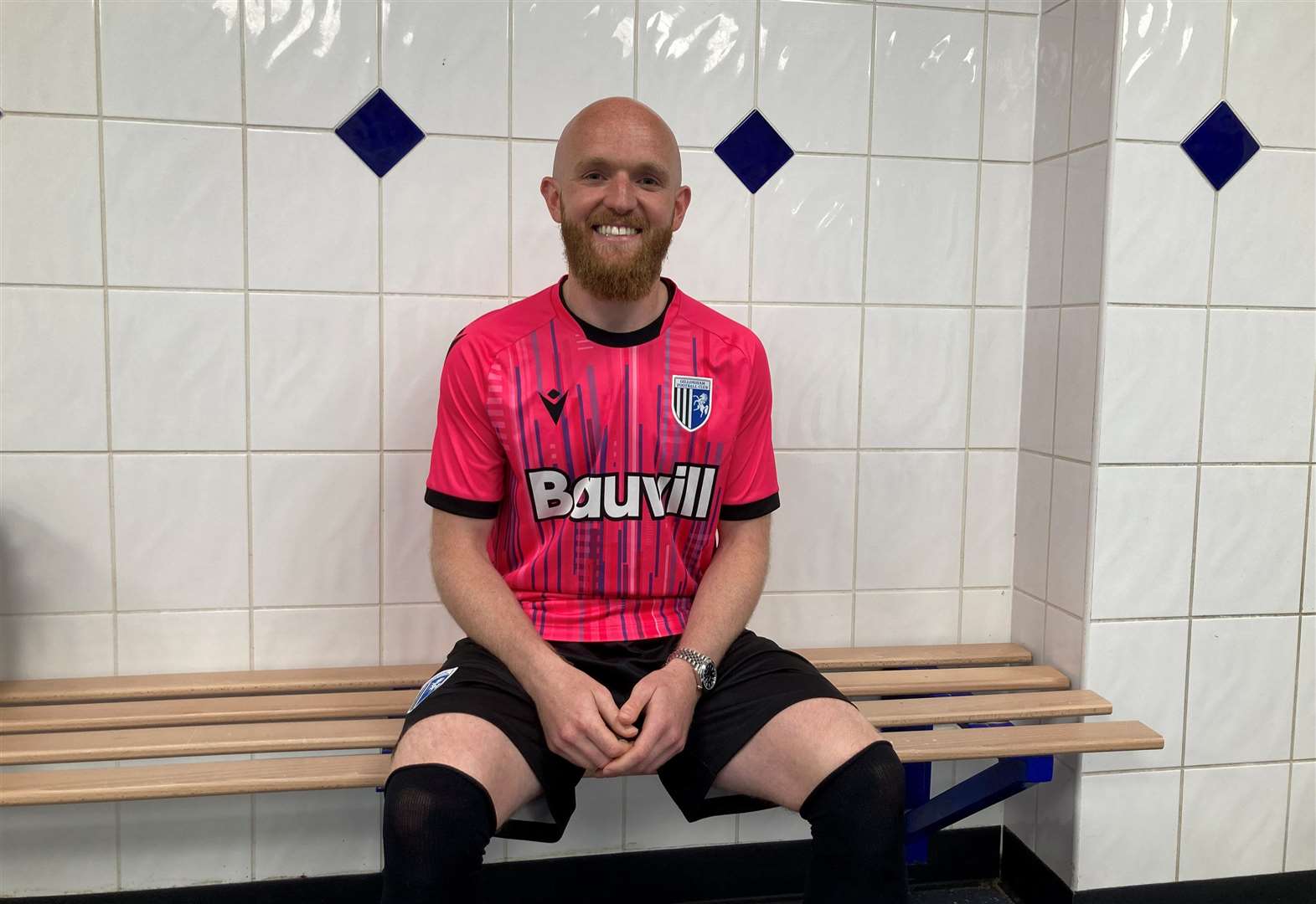 Gillingham's new signing Jonny Williams in the club’s new pink third kit