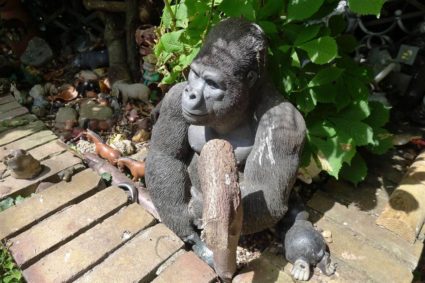 A resin gorilla stands guard
