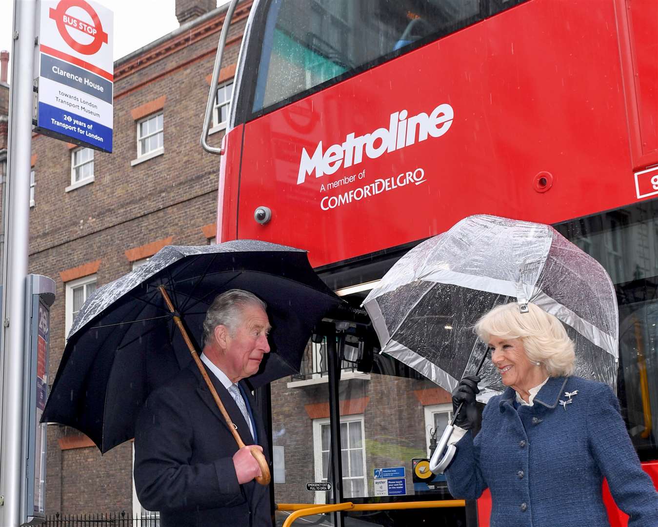The Prince of Wales and Duchess of Cornwall prepare to board a new electric double-decker bus at Clarence House in London (Stuart Wilson/PA)