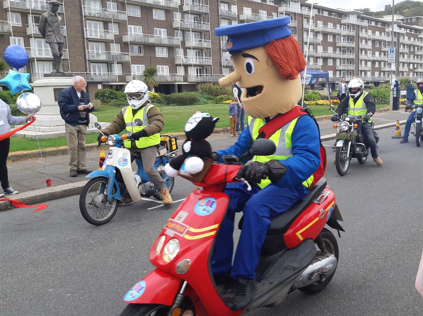 The riders set off with John Rogers as Postman Pat