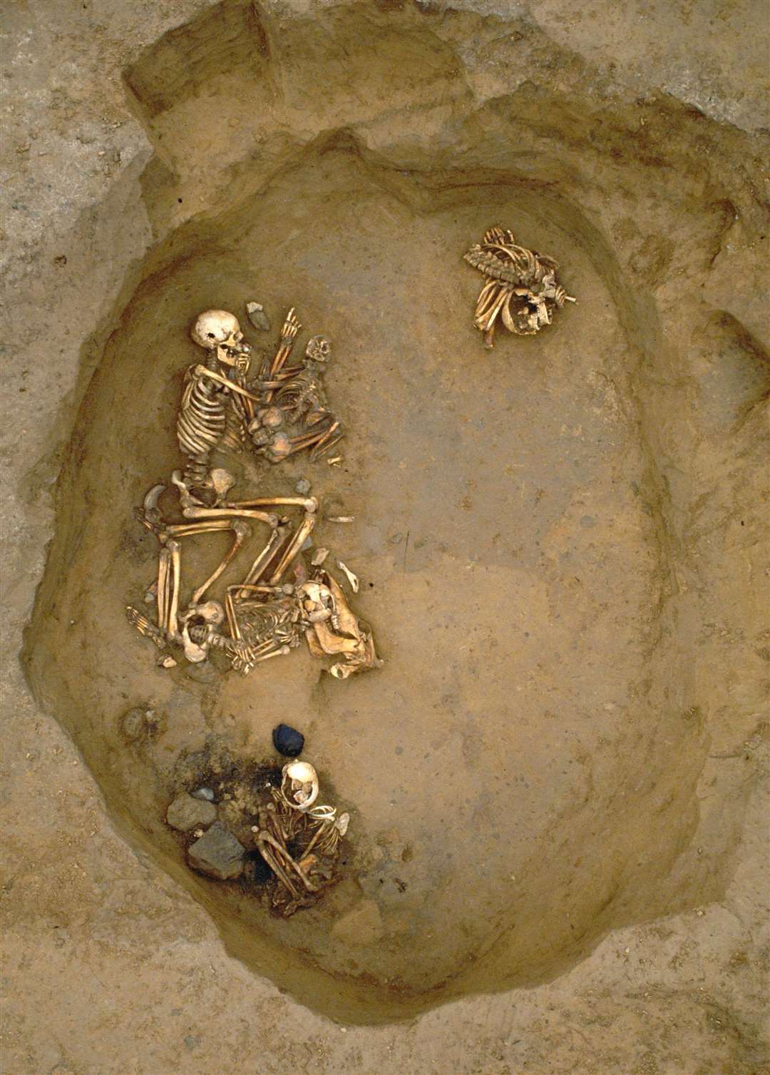 Overview of the Thanet burial pit showing both individuals along with a further two; a teenage girl and female child. DNA analysis has been conducted on all four as part of a new study. Picture: SWNS