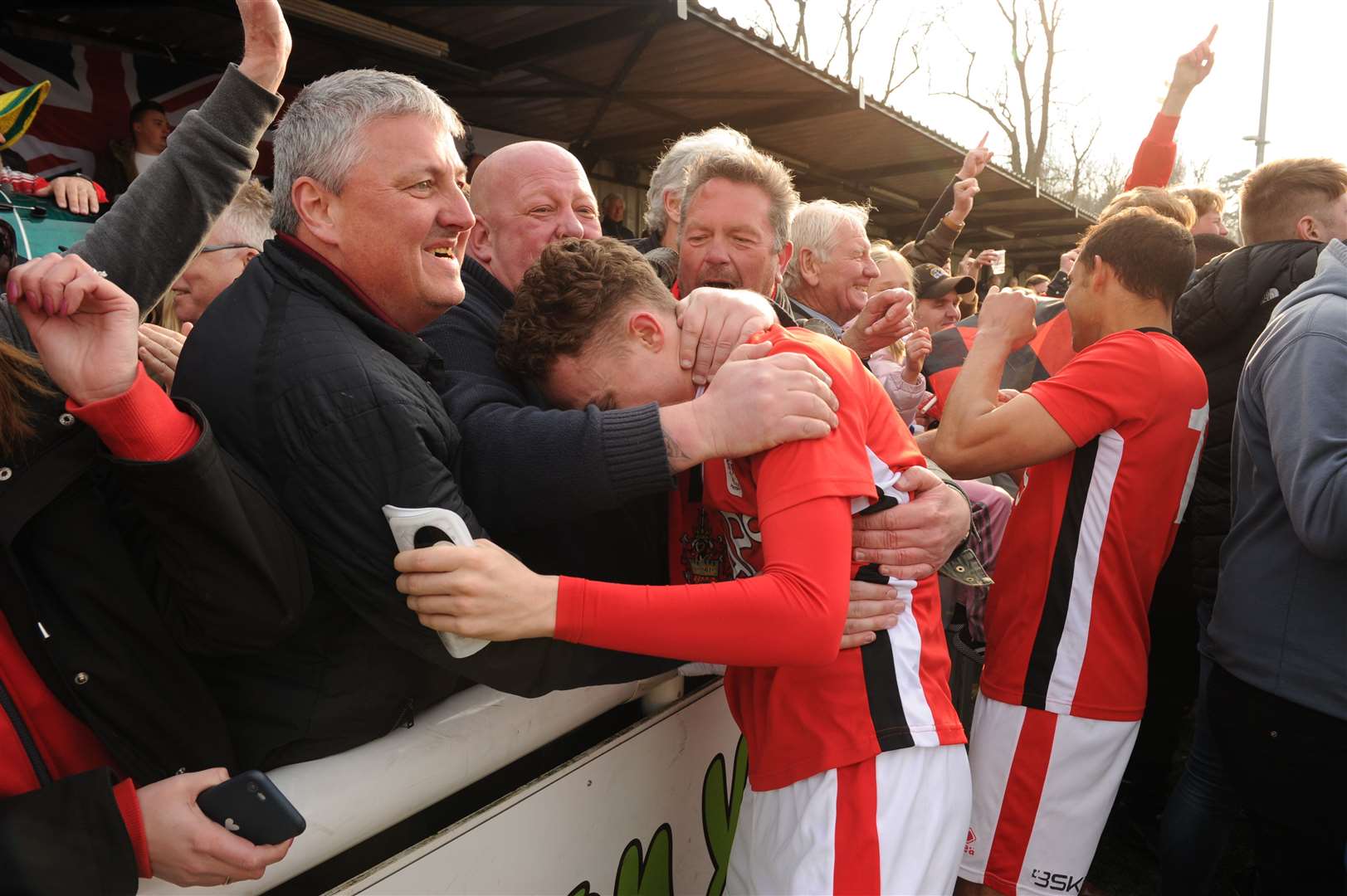 Michael Hagan celebrates with the Chatham fans Picture: Steve Crispe