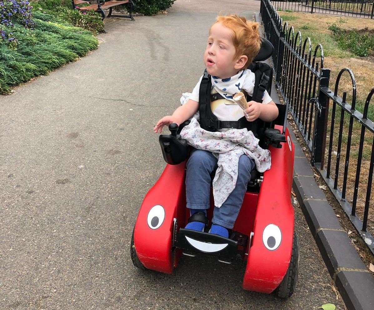 Ezra in his Wizzybug, an outdoor electric chair he had when he was younger