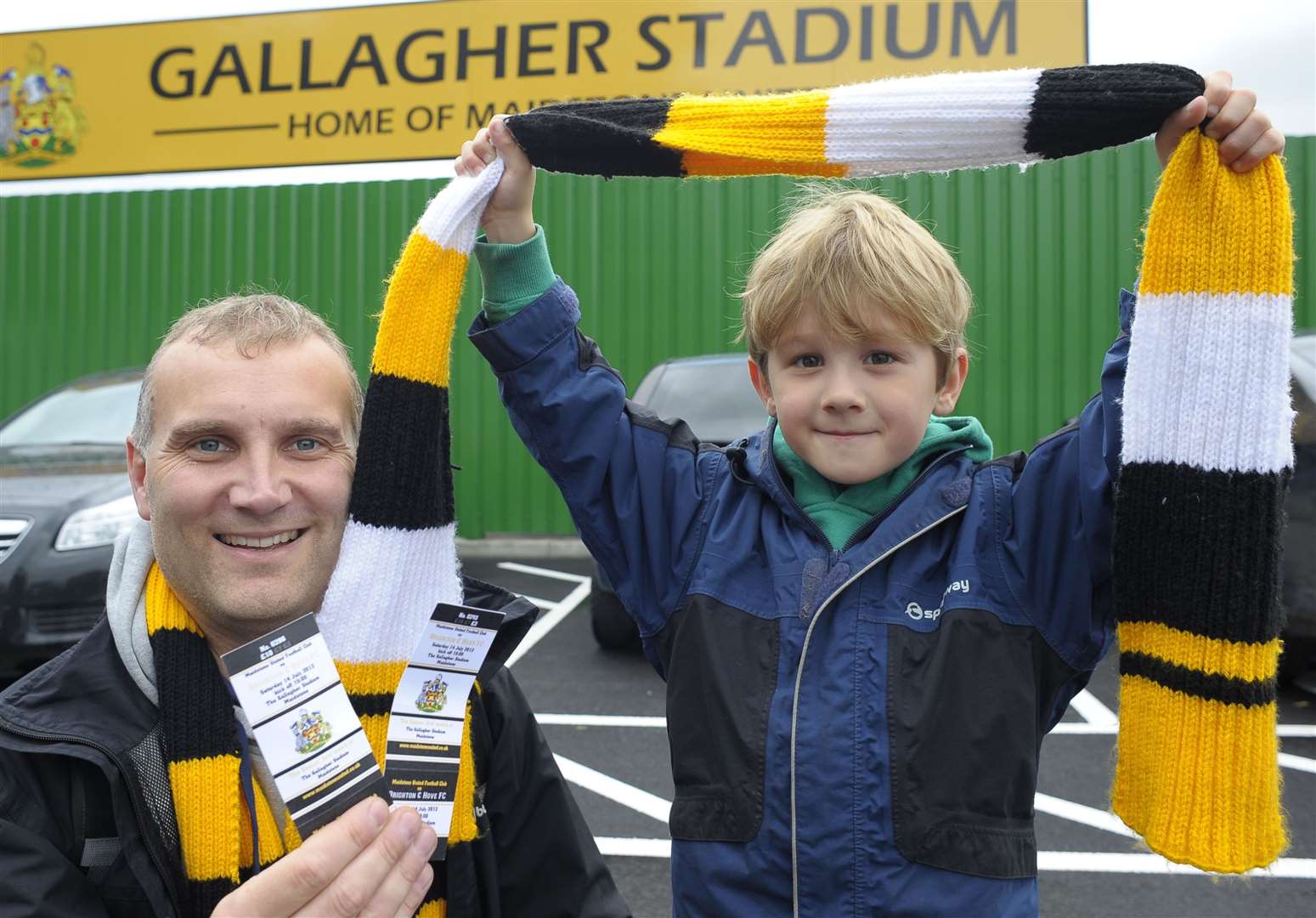 Maidstone fans Matthew and Sam Woodhead with their tickets for the first game at The Gallagher Stadium. Picture: Ady Kerry