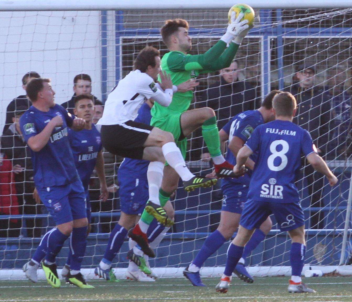 Margate keeper Henry Newcombe makes a safe catch against Burgess Hill Picture: Don Walker