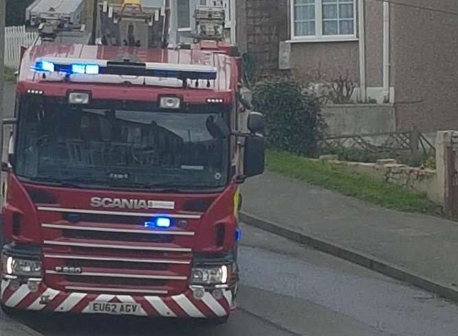 A fire engine leaves the scene in Seaside Avenue, Minster