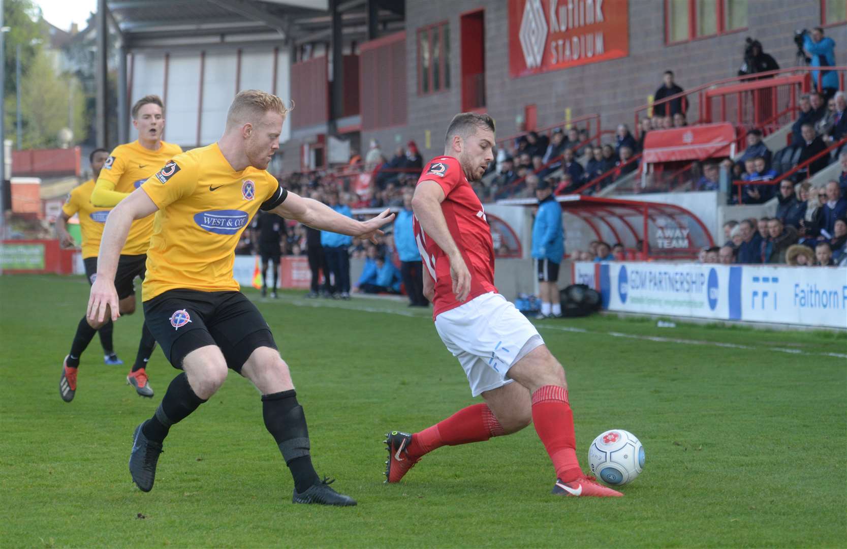 Michael Cheek tracked by former Ebbsfleet defender Kenny Clark Picture: Chris Davey