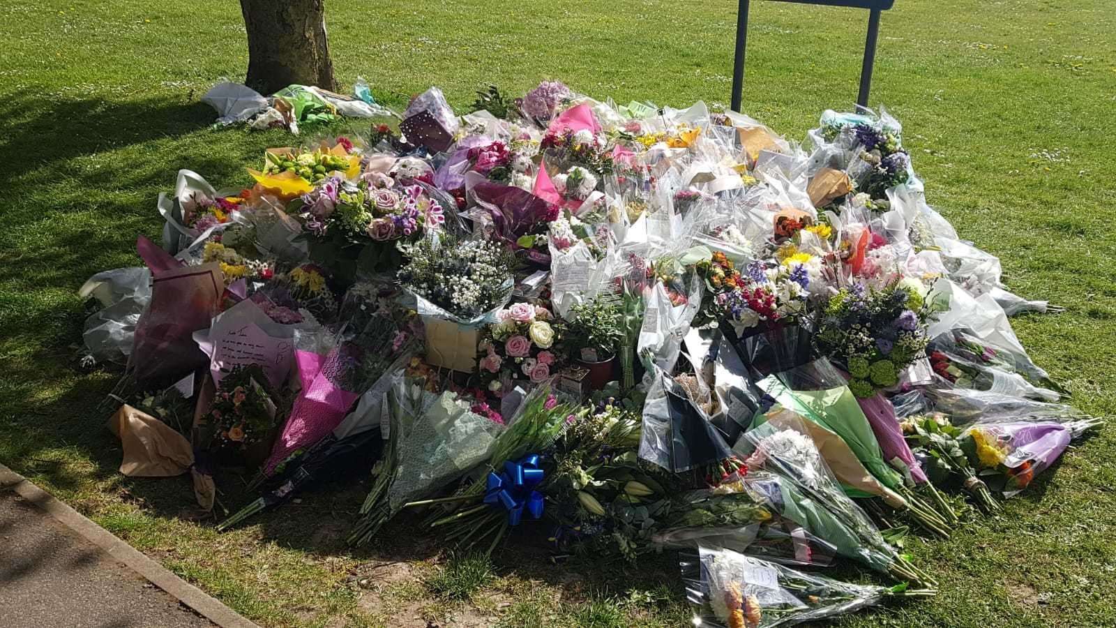 Flowers left in Aylesham's village square, for PCSO Julia James