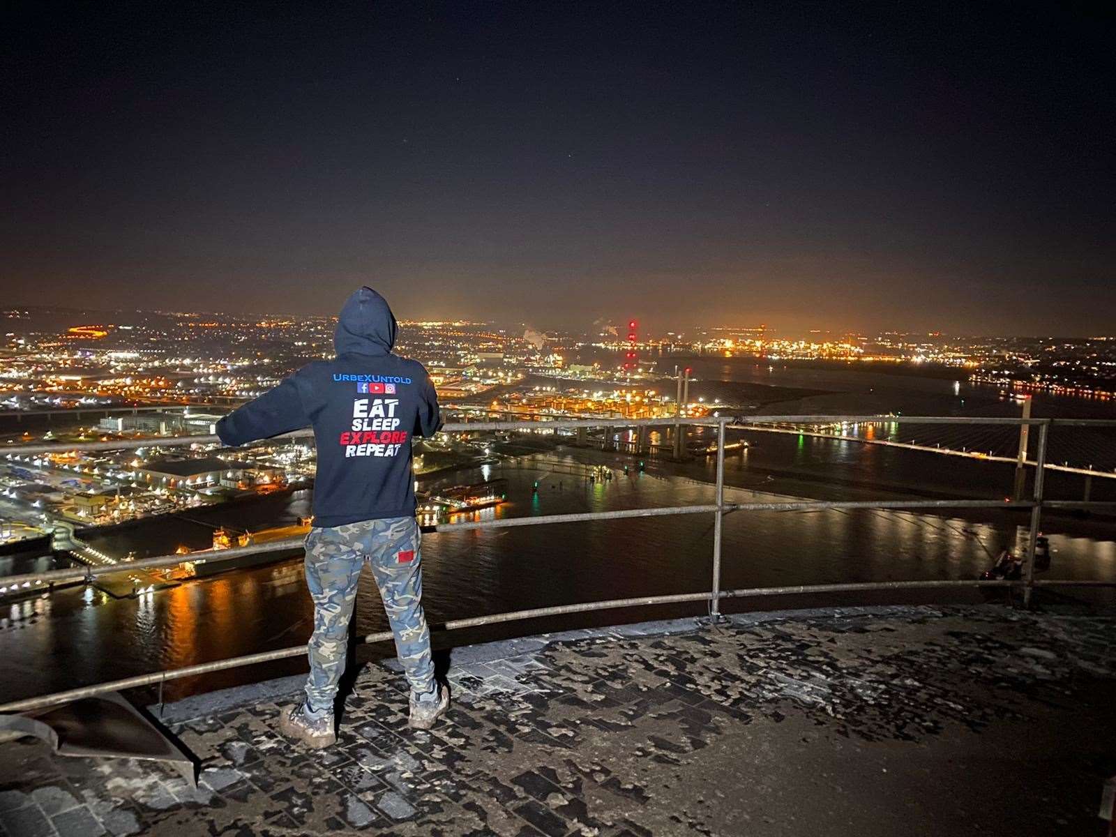 Urban explorers at the top of Littlebrook Power Station chimney before its demolition. Picture: UrbeXUntold