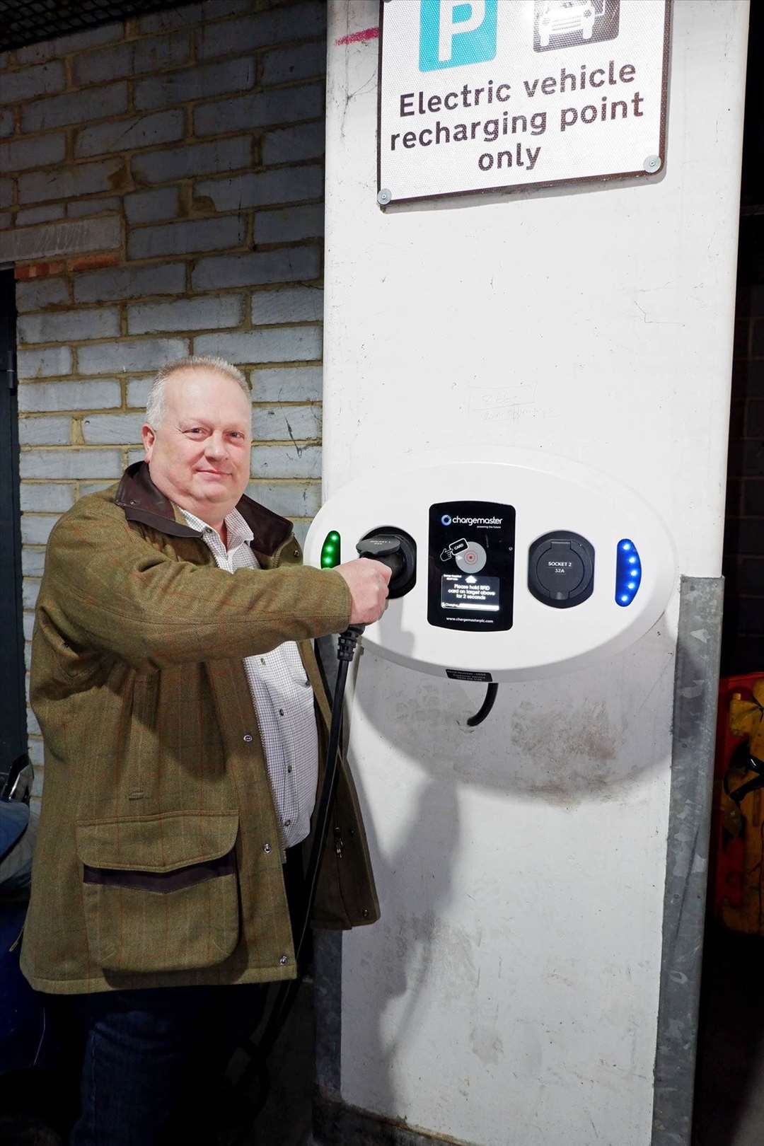 Cllr David Burton, of Maidstone Borough Council, with a charging point (9818202)