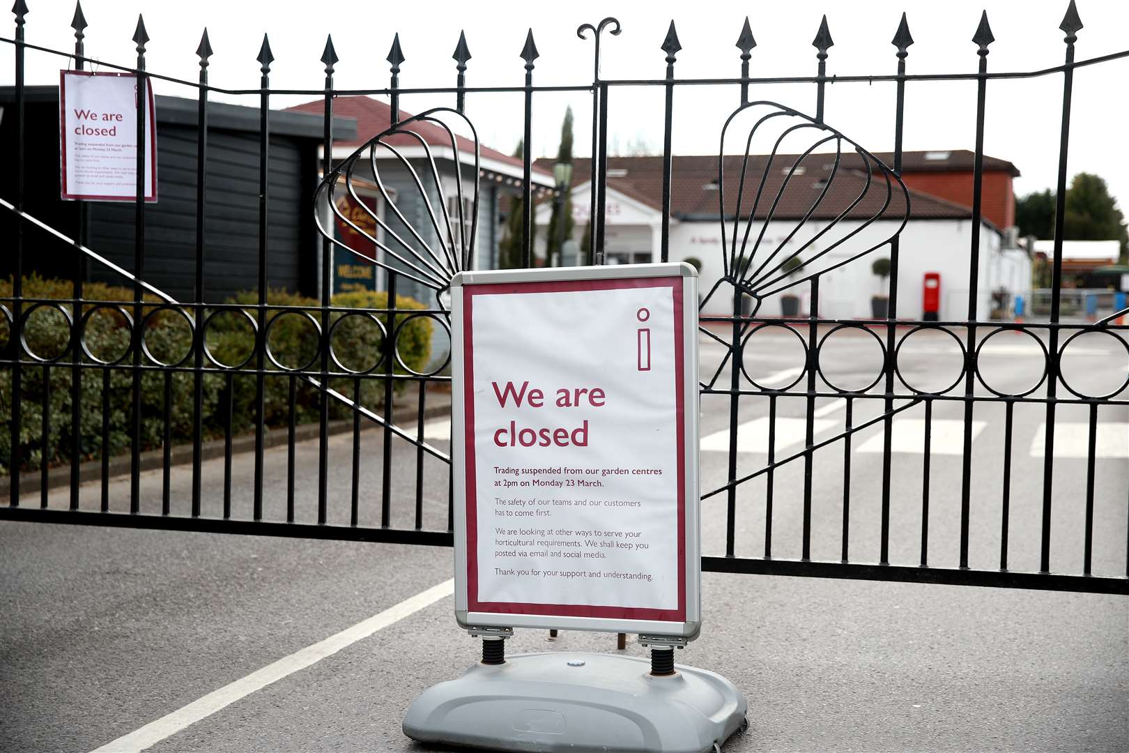 A sign in front of closed gates at Squire’s Garden Centre in Farnham, Surrey. Garden centres are to be allowed to reopen next week (Adam Davy/PA)