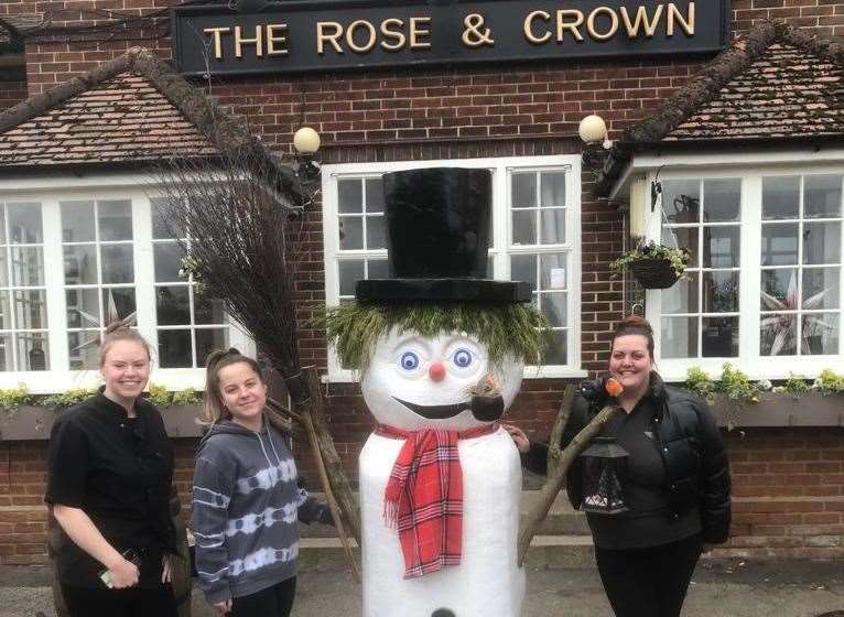Boris the snowman, or should that be Snow-Jo, with staff outside The Rose and Crown at Hartlip