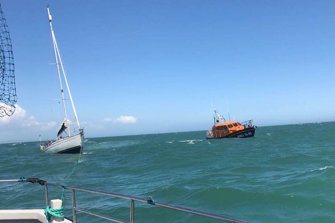 The yacht was towed by a fishing boat before Dungeness lifeboat took over. Picture: Ant Hills