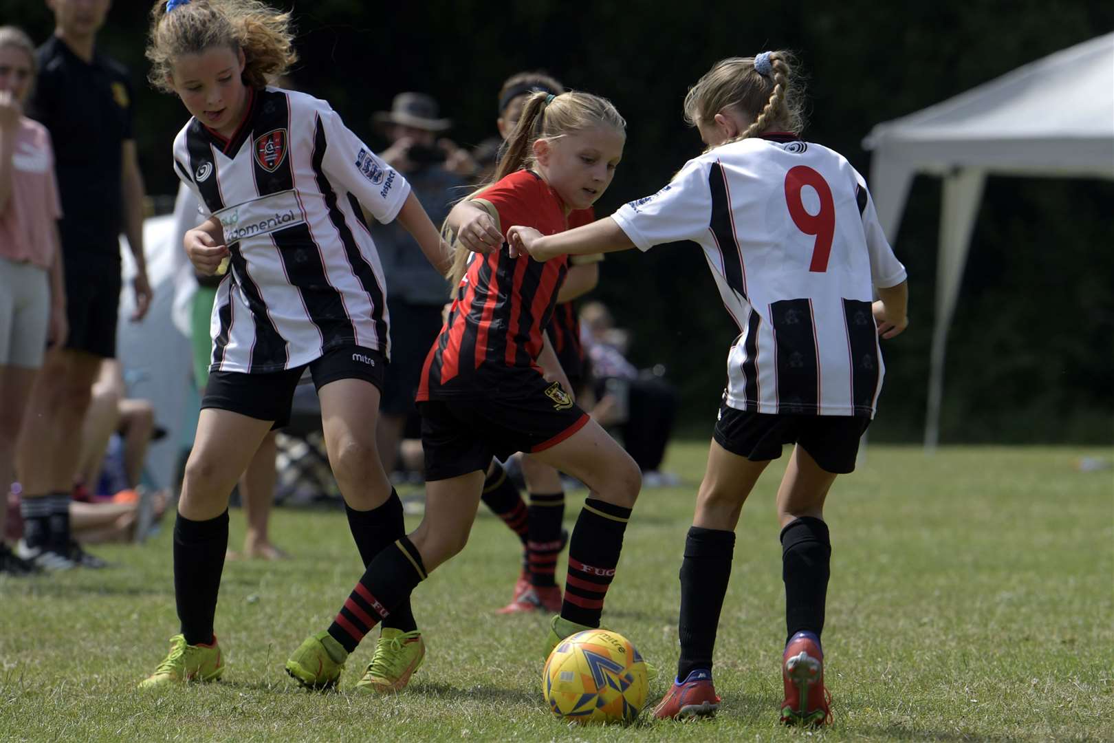Liv Whitlock (in red and black) playing for Sittingbourne Ladies against Crayford Arrows Red U9.  Photo: Barry Goodwin