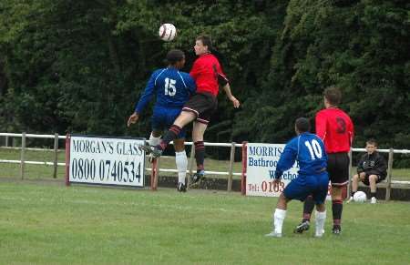 The Chatham defender (red) wins a towering header against Margate on Saturday. Picture: VERNON STRATFORD
