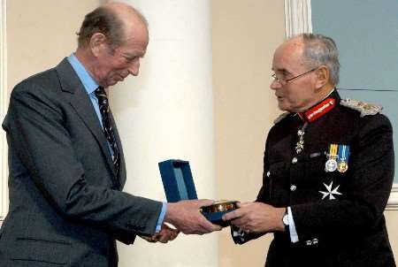 The Duke of Kent receives his award from the Lord Lieutenant of Kent, Allan Willett.