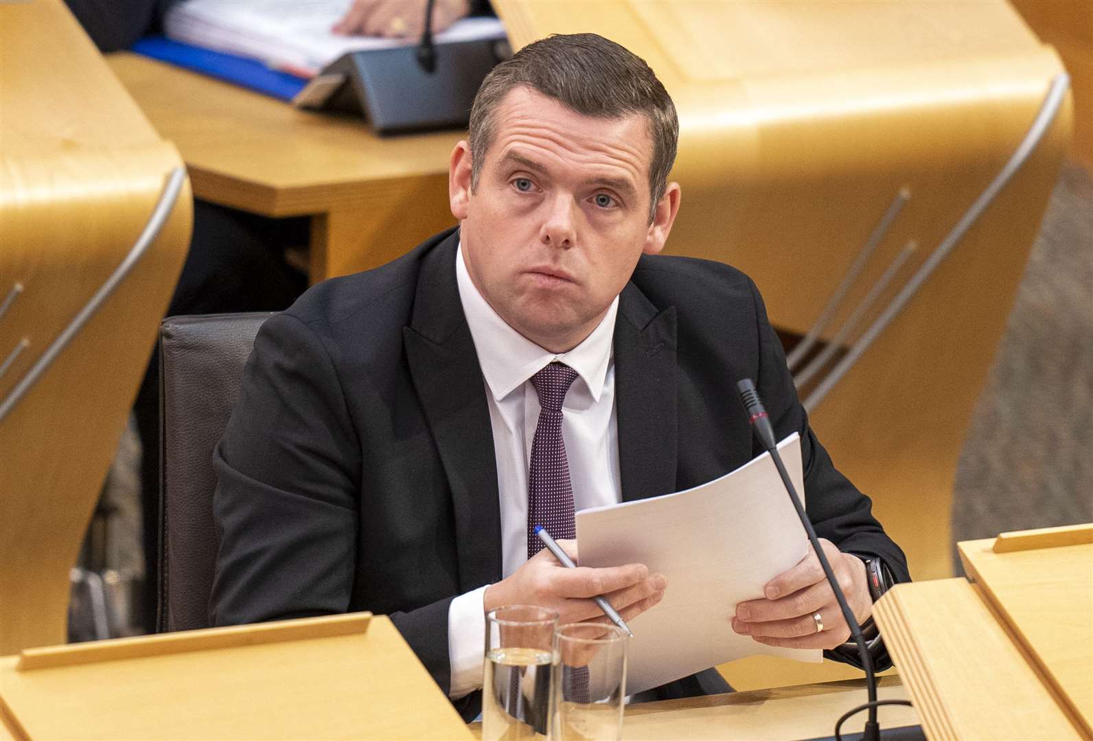 Scottish Conservative leader Douglas Ross used a debate at Holyrood to brand the former first minister a ‘liar’ and a ‘fraud’ (Jane Barlow/PA)