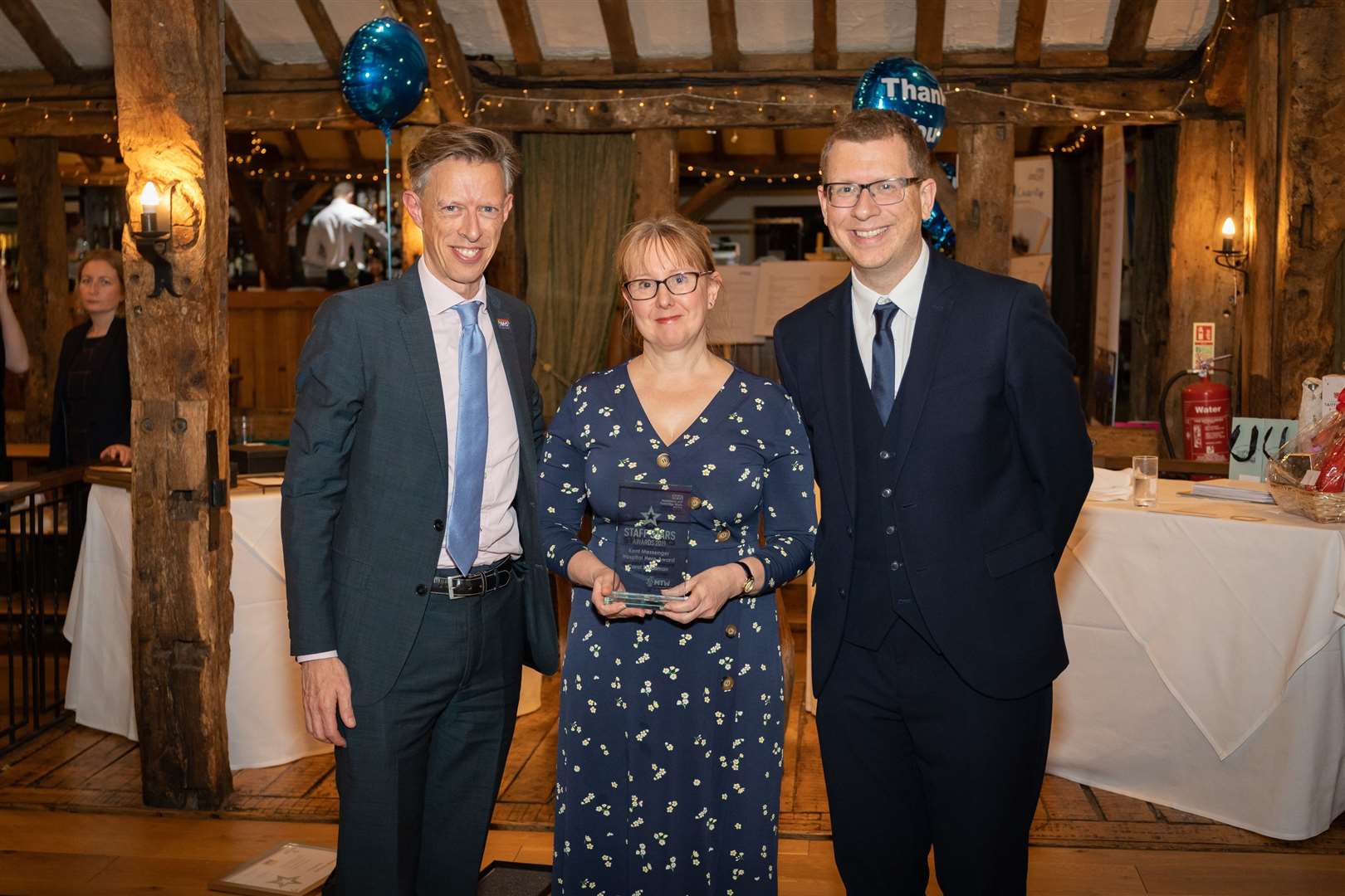 Carol Smallman, paediatric specialist teams matron, won the Tunbridge Wells Hospital Hero award. Pictured with CEO Miles Scott, left, and Paul Kerensa, comedian, right who helped host the event