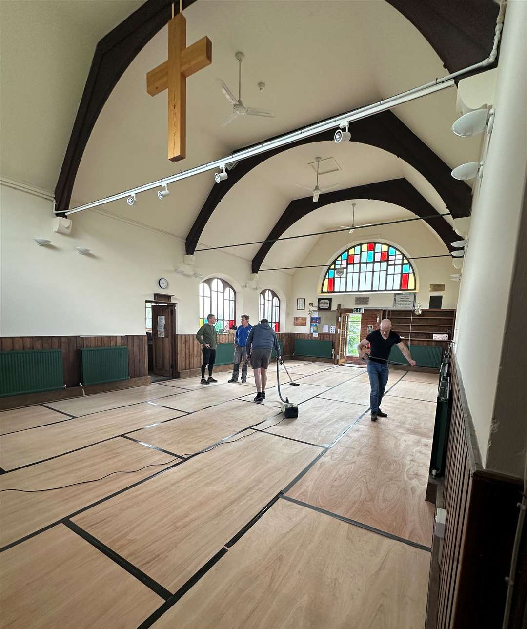 The team and members of the community came together to get new flooring and paint the church. Photo: Rosy King
