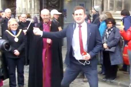 Discoboy dances in front of the Archbishop.