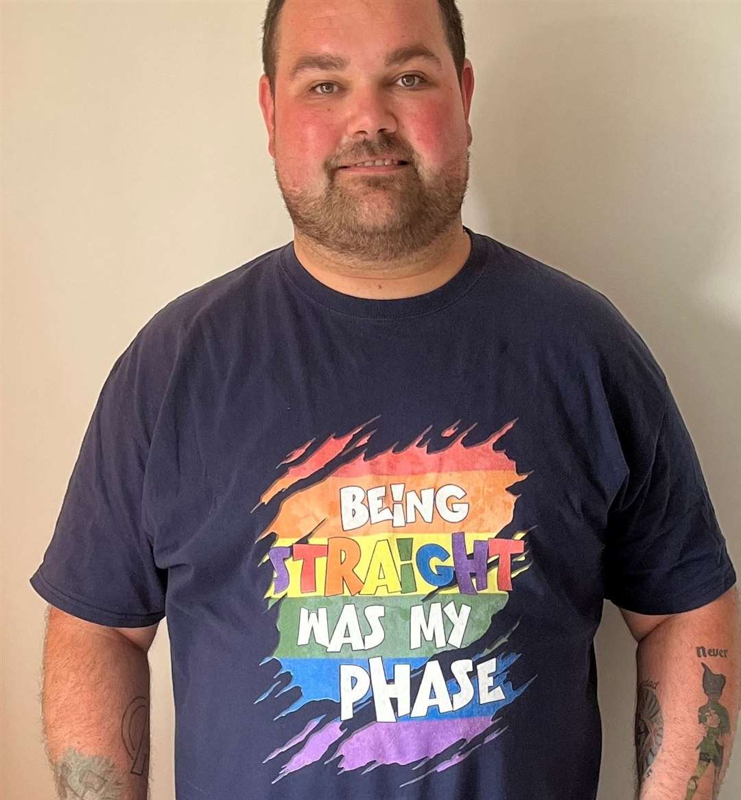 Sam Fry with the t-shirt he wore to his first Pride event