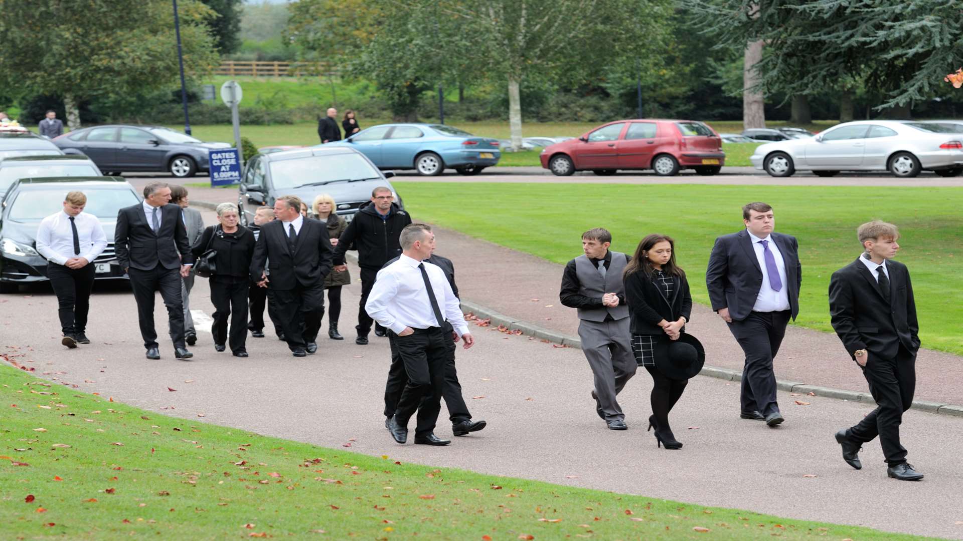 Relatives arrive for the service