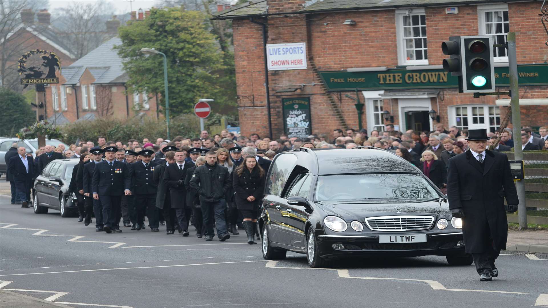The funeral procession for Dazy Saunders sets off from The Crown pub on its way to nearby St Michaels Church
