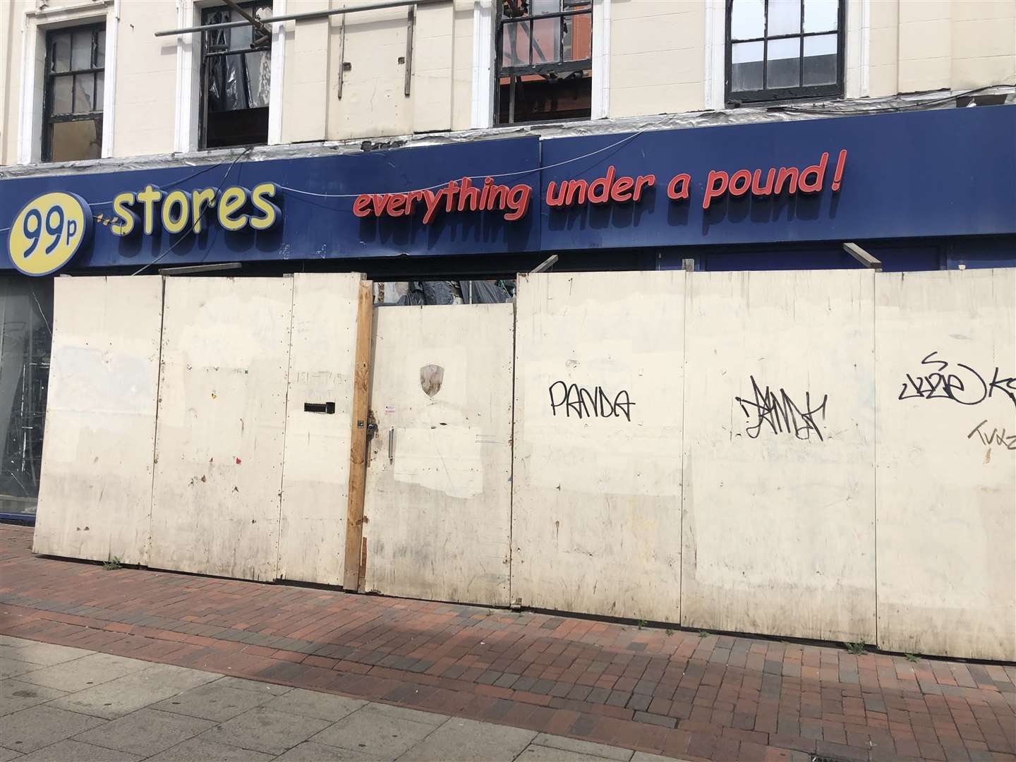 A boarded-up 99p Stores in Chatham High Street