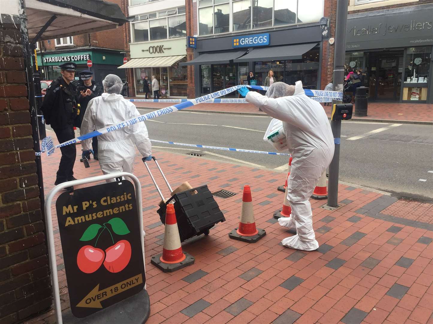 Forensics officers arriving at the nail bar in Tonbridge High Street following the attempted murder