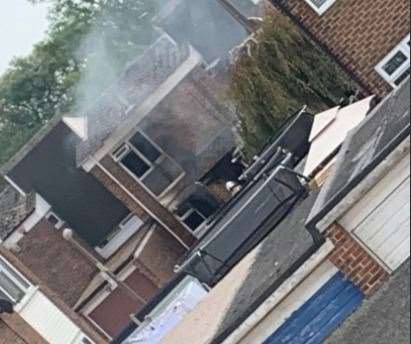 Firefighters remain at the scene of the blaze in Moyle Close, Rainham. Photo: Linzi Coulter