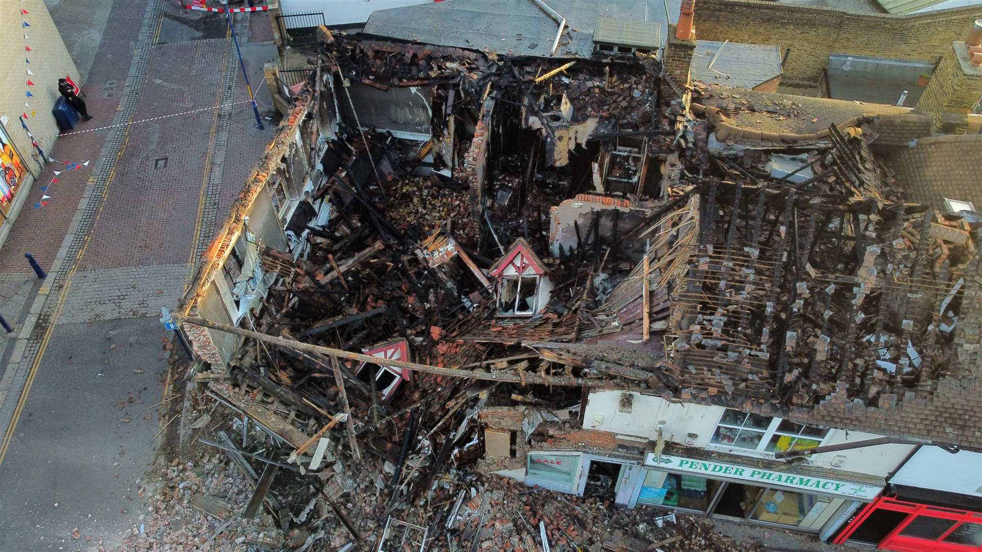 The remains on Friday, May 27 as the building collapsed into the street