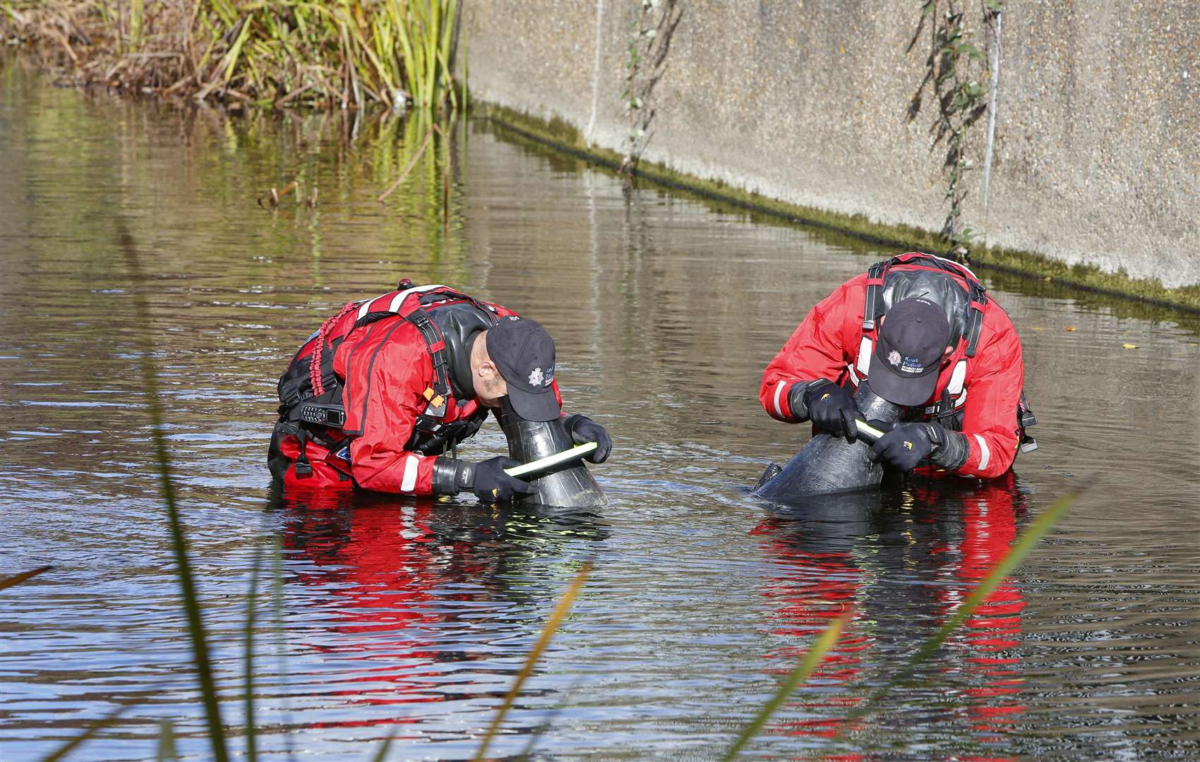 Police searching the River Darent yesterday as part of the search for Sarah Wellgreen. Picture: Andy Jones