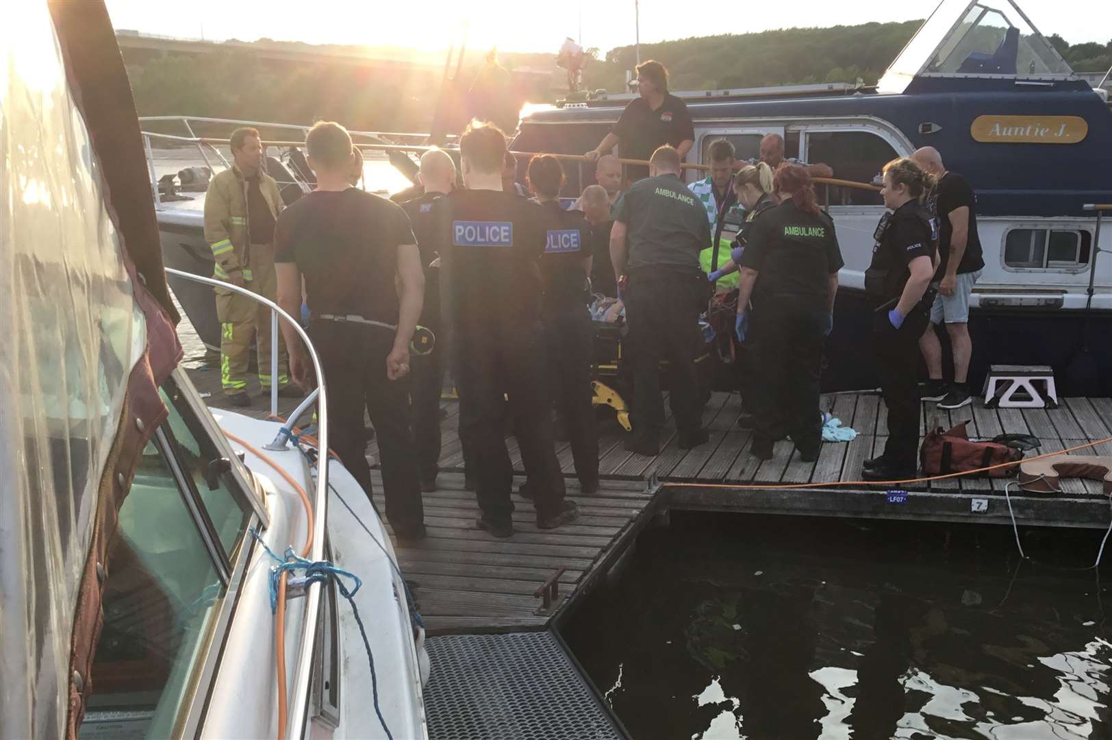 Police and paramedics with the woman at Medway Bridge Marina