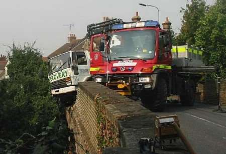 The lorry perched precariously over the bridge. Picture: LIZA MURLEY