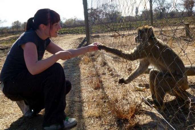 Louise Smith with one of the macaques at a sanctuary in South Africa