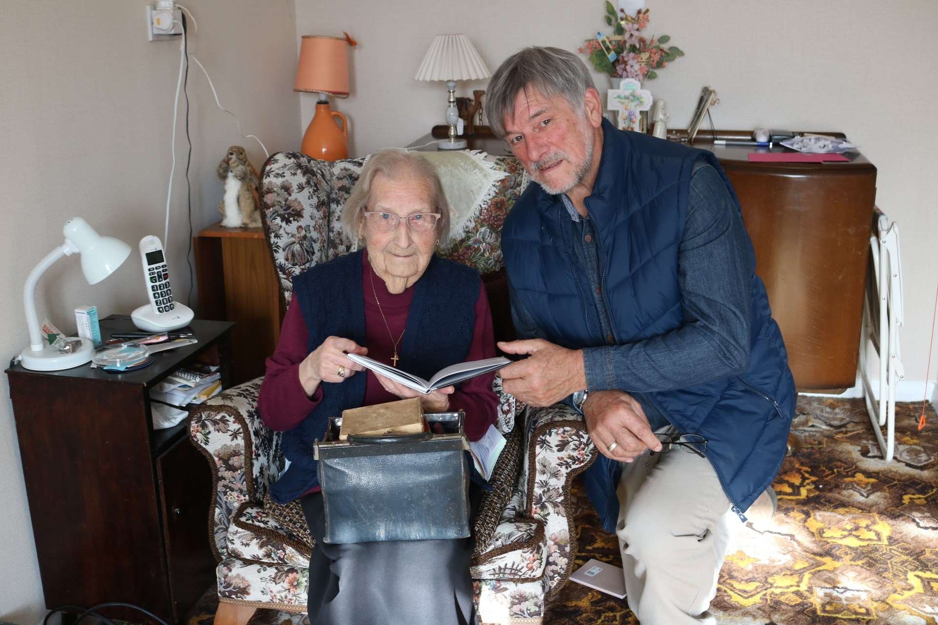 Irene looking through one of her 80 diaries with nephew, Roy Daines, 70.