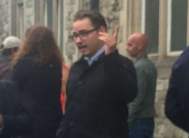 Jordan Brachio, with black coat and glasses, appeared before magistrates