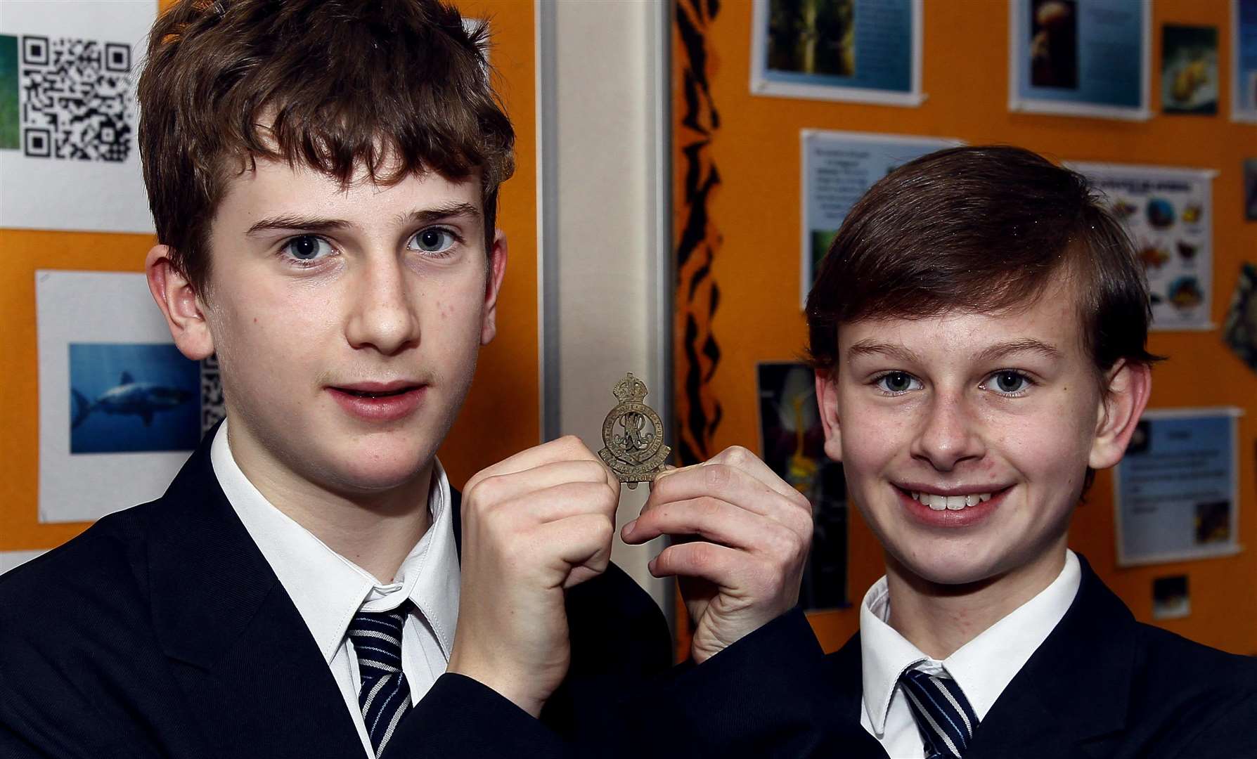 Thomas Eckley (left) and Daniel Reilly (right) found a First World War cap badge in the school grounds. Picture: Sean Aidan (6927205)