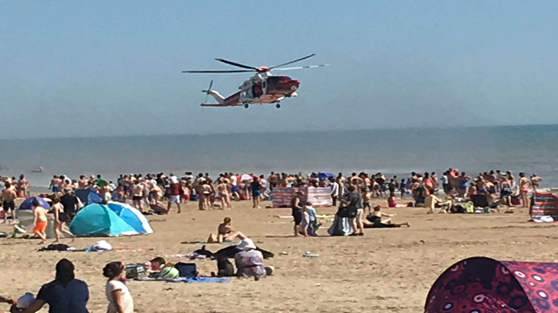 The scene at Camber Sands when five men died last summer