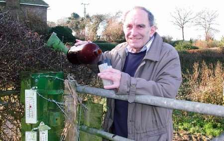 Farmer Tom Castle takes the latest rainfall measurements. Picture: GERRY WARREN