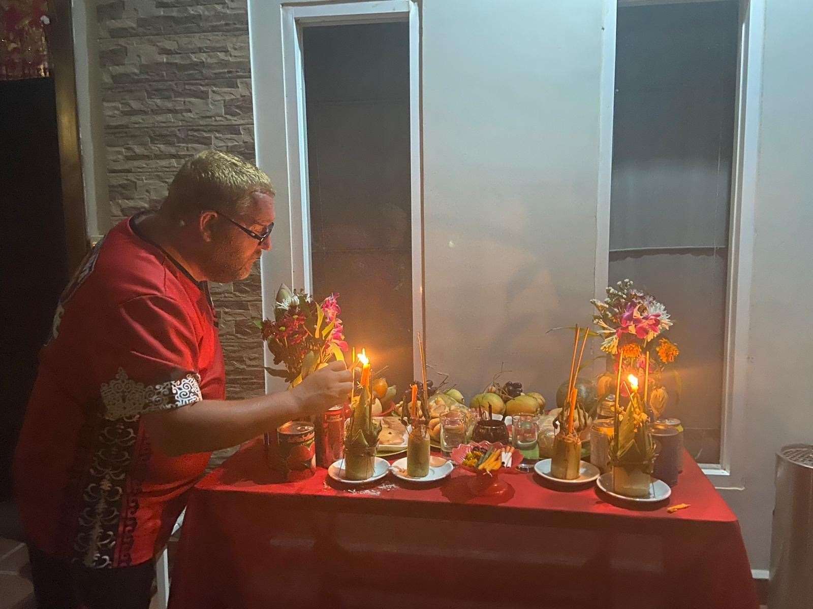 Gareth puts out offerings for Kymer new year in Cambodia on April 13. The streets are normally full of parties and people and water fights in Bar Street in Siem Reap but none of that happened this year
