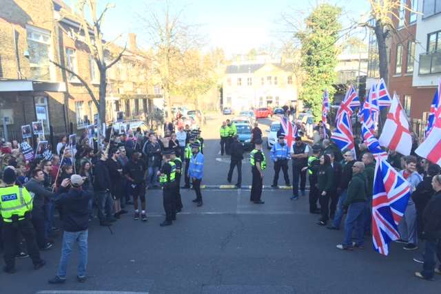 Britain First (right) and the people who oppose them outside Rochester train station
