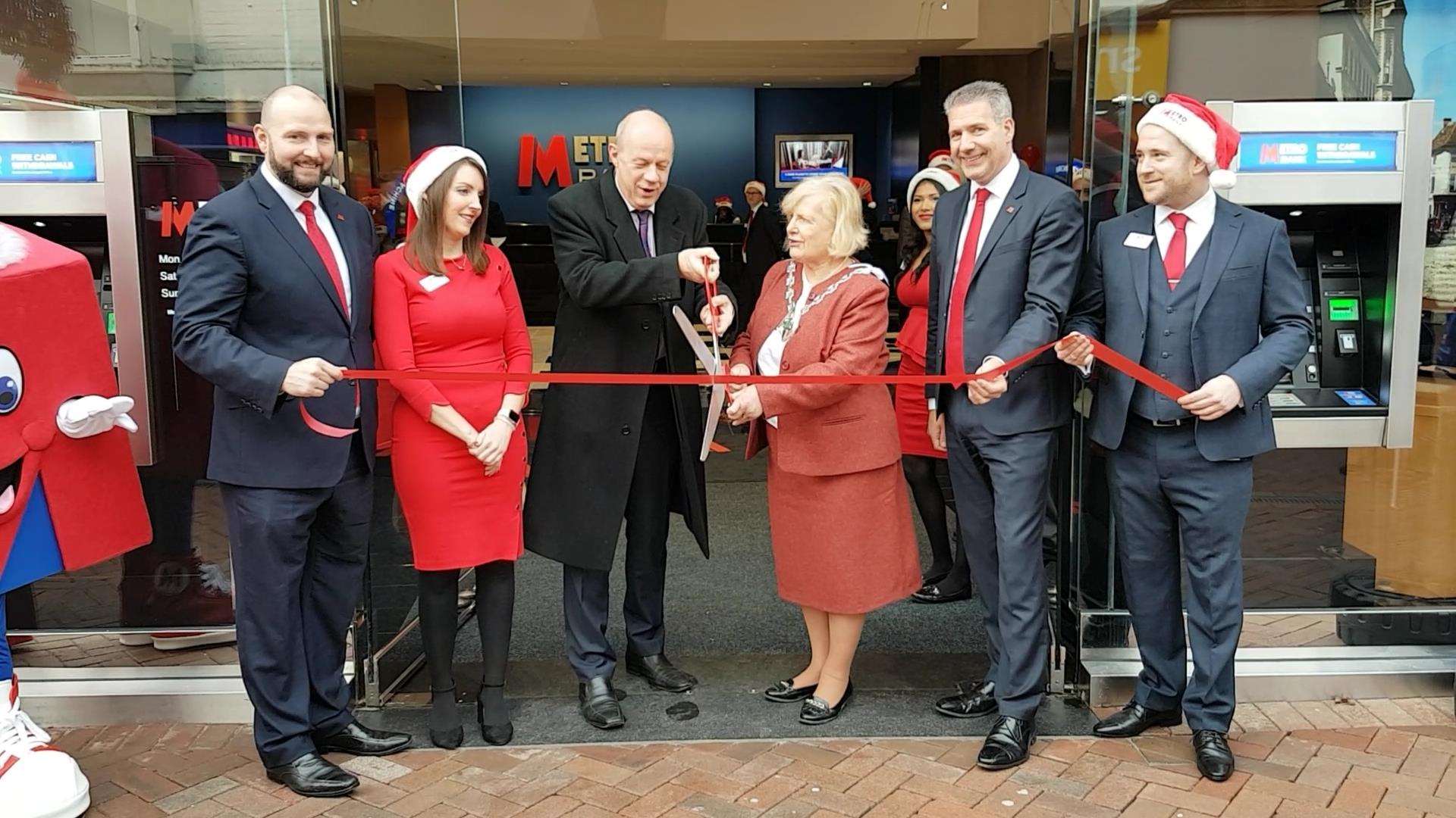 Cutting the ribbon. From left to right: Kevin Walker, Metro Bank's regional director; Kerri Miller, Metro Bank's local director, Rt Hon Damian Green MP, Ashford Mayor Cllr Jessamy Blanford; Iain Kirkpatrick, managing director of Retail Banking for Metro Bank; Daniel Shade, the banks's store manager. (6174311)