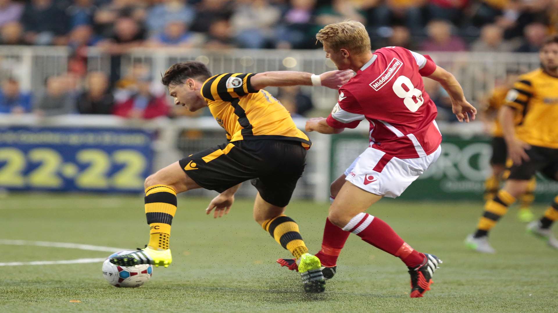 Jordan Parkes challenges Frannie Collin during Tuesday night's derby Picture: Martin Apps