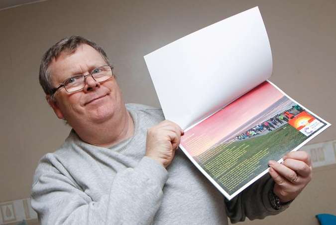 Lee Ewart with calendars from the Seaside Sunset Stroll