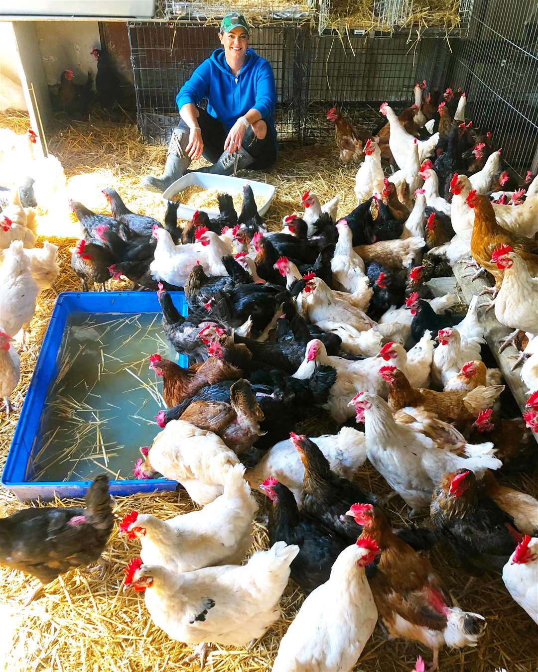 Happy Pants Ranch founder Amey James, with rescued hens among older chickens she already had