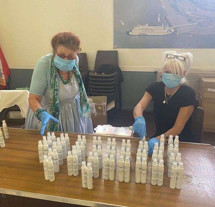 Sheerness Town Council's Cllr Chris Reed, left, and clerk Yvette Cheesman handing out supplies of PPE at Holy Trinity church hall during the coronavirus pandemic